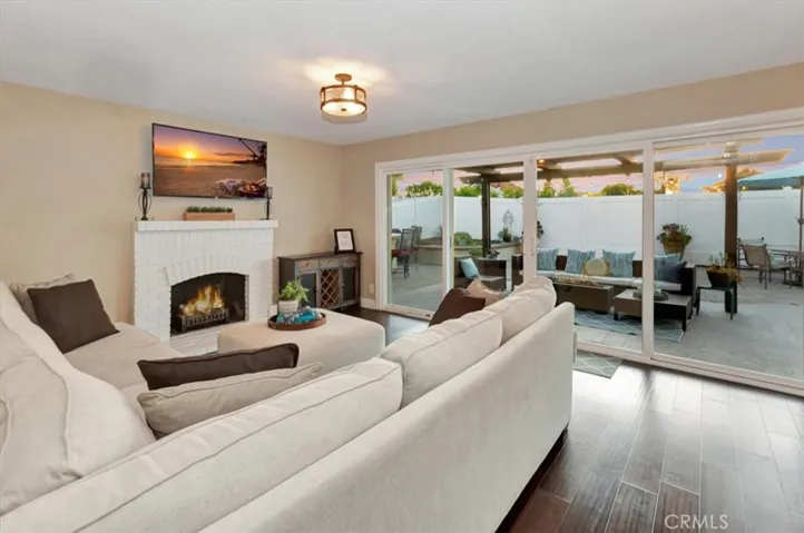 Family room with fireplace and large sliding doors that open to patio