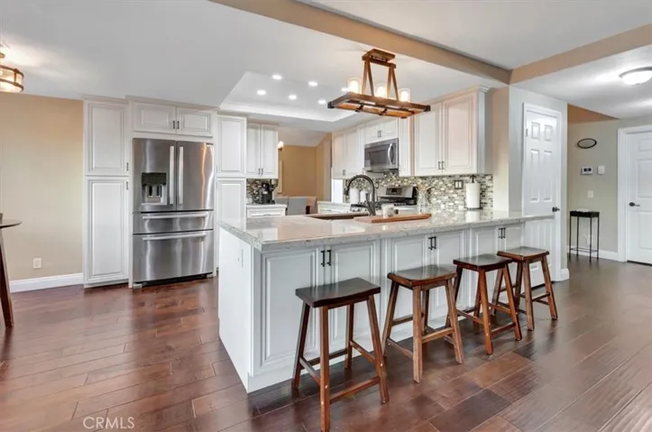 Kitchen opens to family room and has a large bar area