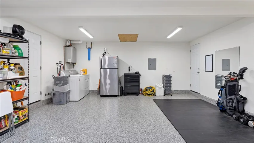 Epoxy Floors, Showcase Lighting and Reinforced Attic Storage with Pull-Down Stair