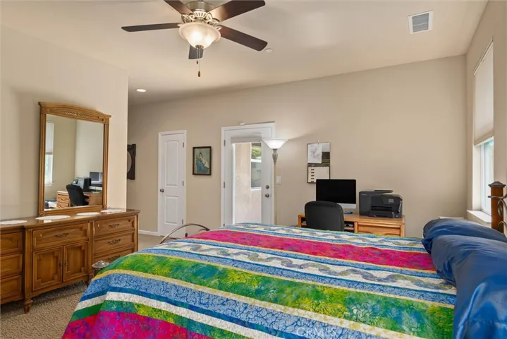 Primary bedroom with door to patio