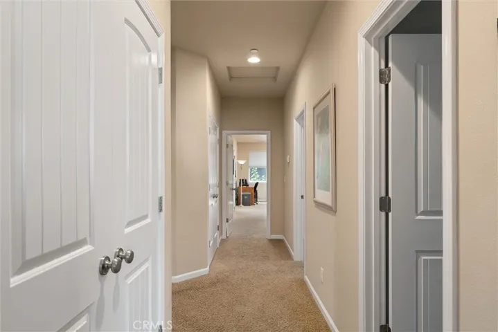 Hallway with two double door linen closets