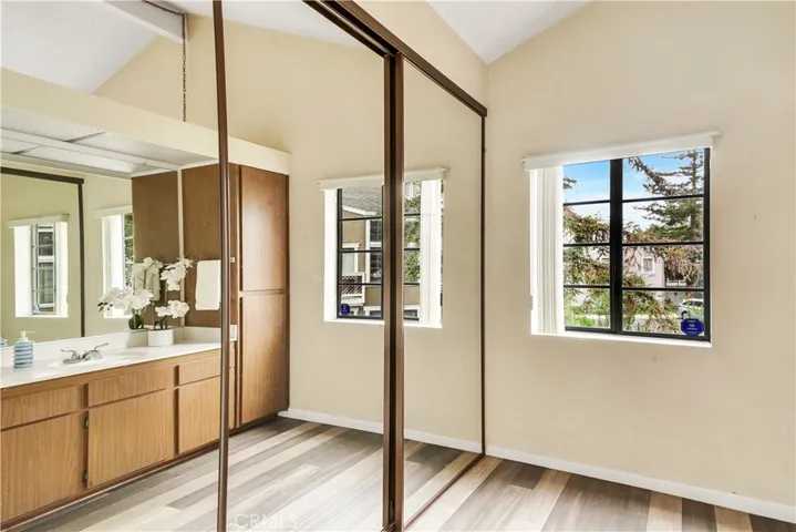 Mirrored closet in the Primary Bathroom