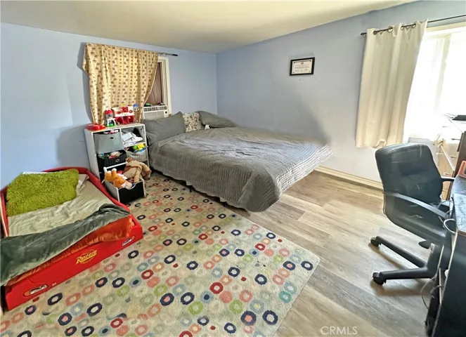 1st Bedroom has Wood Laminate Flooring