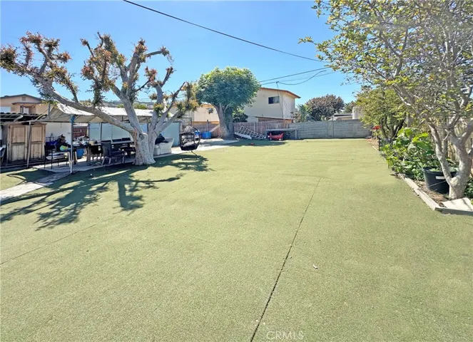 Giant Backyard with Fencing of Block Wall and Newer Wood Fence