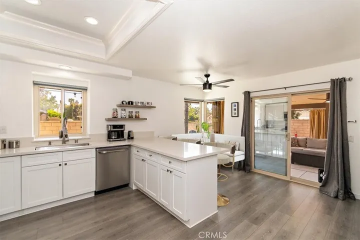 Kitchen and virtuallly staged dining room.