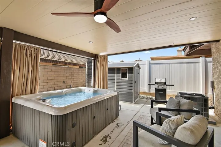 Relaxing spa under covered patio.