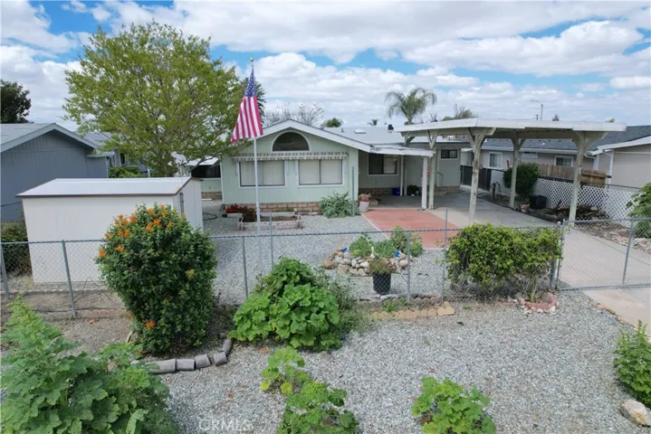 Chain-Link Fence Surrounds The Backyard