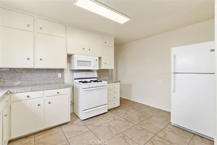 Kitchen comes with free standing range, fridge and dishwasher