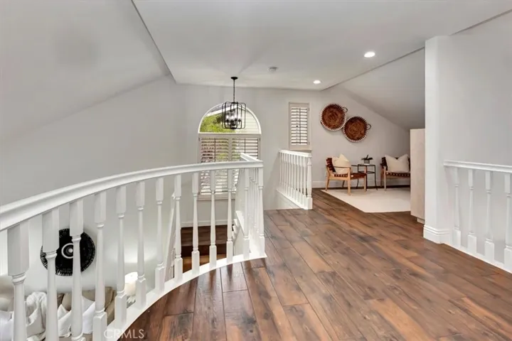 Dramatic stairwell leads you upstairs to retreat.
