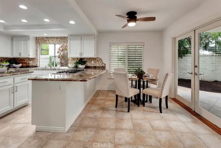 Breakfast nook with French leading to the backyard oasis.