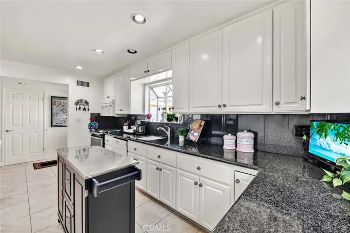 Granite Counters in Kitchen With Recessed Lighting