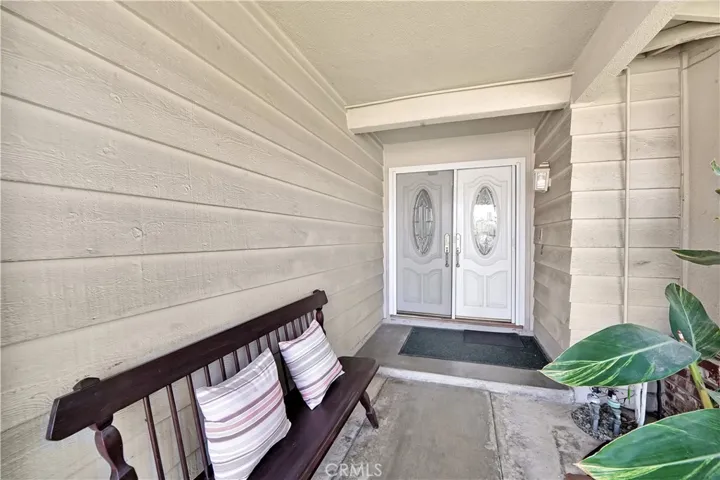 As you approach, you're greeted by a charming covered front porch, setting the stage for the elegance within.
