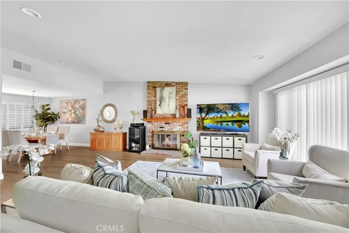 Step through the double door entry with leaded glass into a spacious foyer with vaulted ceilings, recessed lights, A/C, an all house fan, solar power (see supplements for details) and luxury LVT wide plank flooring throughout.