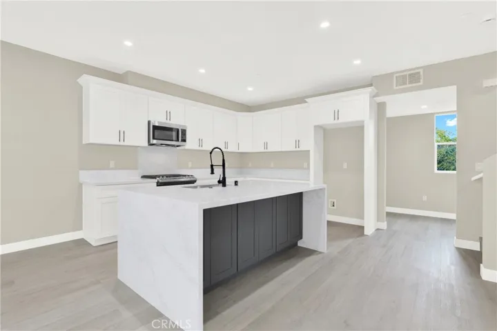 Kitchen with Large Waterfall Island