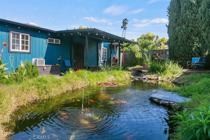 Relax in the backyard next to your very own koi pond.