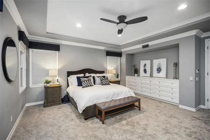 Primary bedroom suite with built-in cabinets