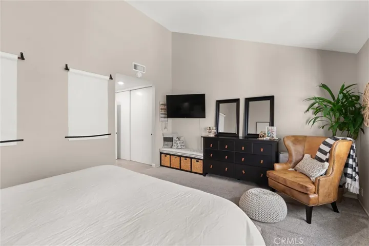 Primary bedroom with sitting area.