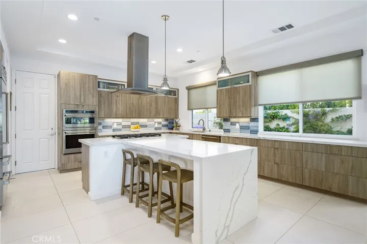 Kitchen with slab quartz waterfall