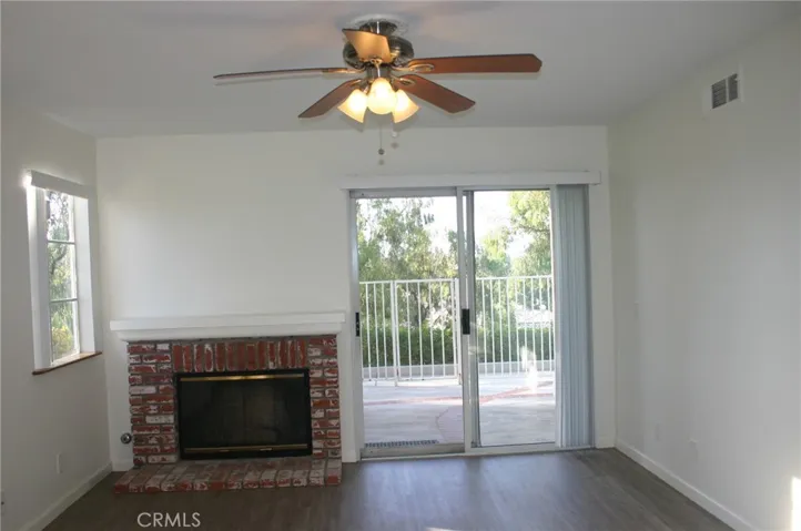 Living Room has a gas fireplace and slider to the patio
