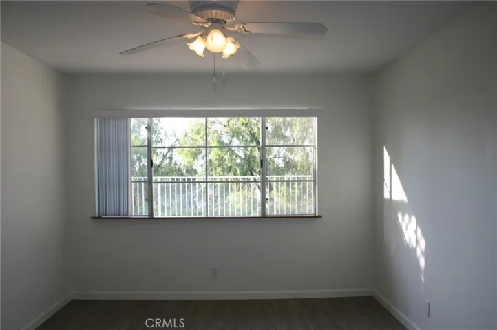 Primary bedroom with a view of the trees