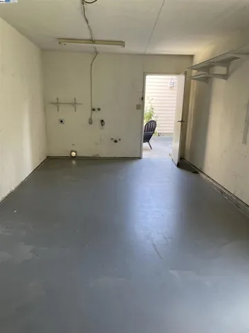 one car garage with new epoxy coat and hookups for
