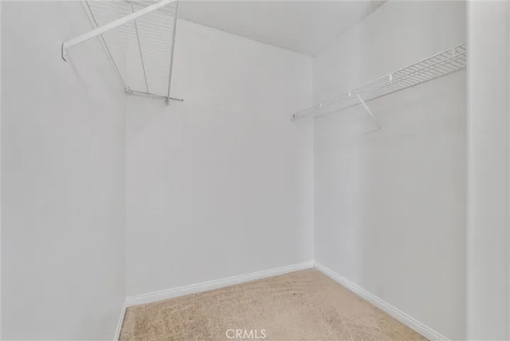 large walk in closet in the primary bedroom