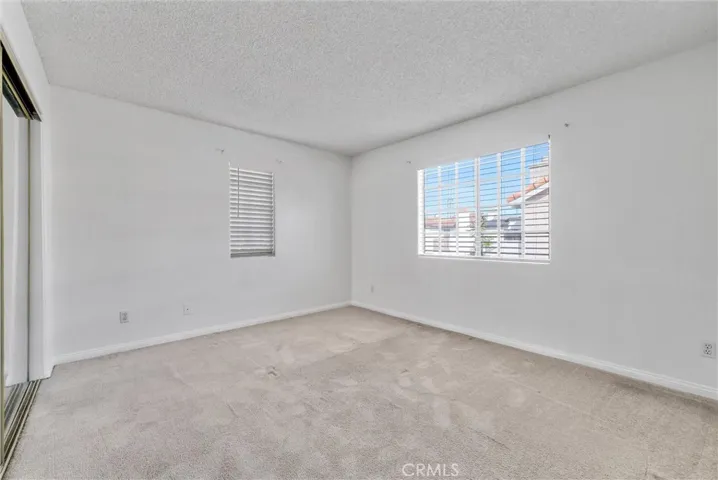 two windows in one of the bedroom