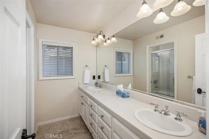 Upstairs hall bathroom with double sink vanity