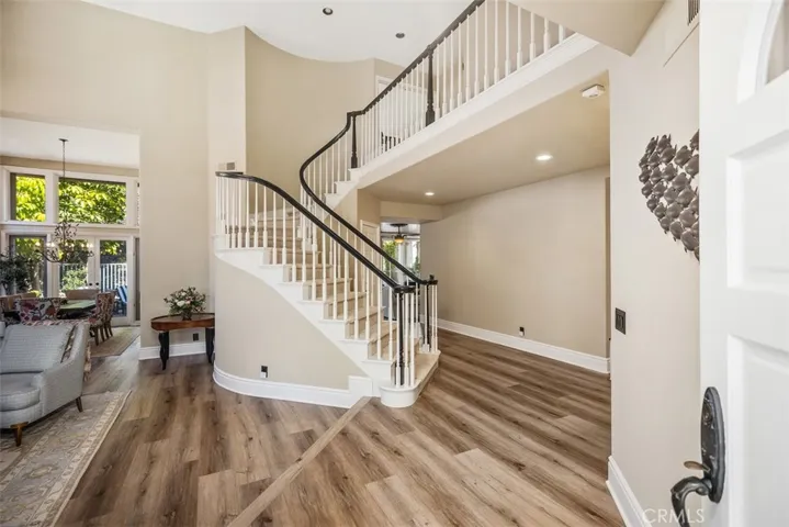 Foyer with soaring celingings & natural light