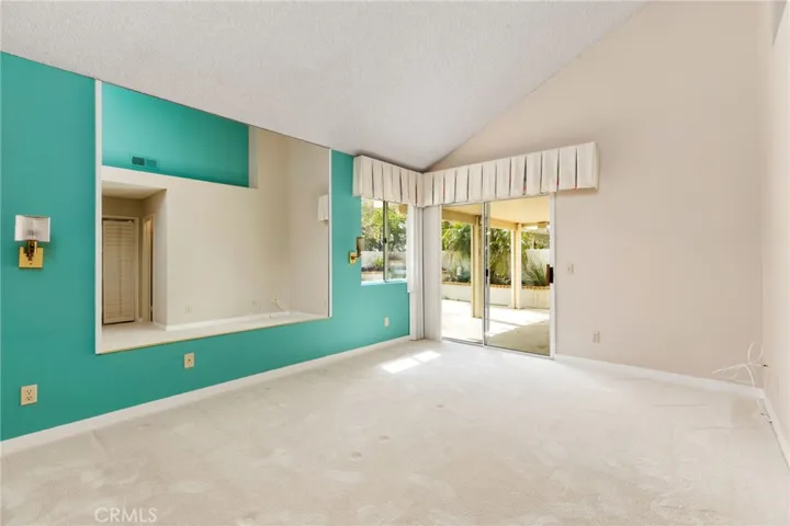 Master bedroom & slider looking out to patio.