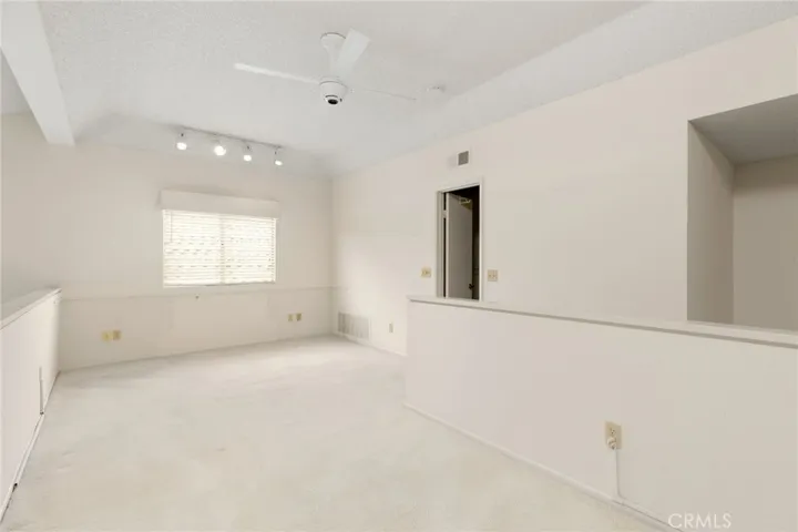Loft with walk-in closet at the top of the stairs