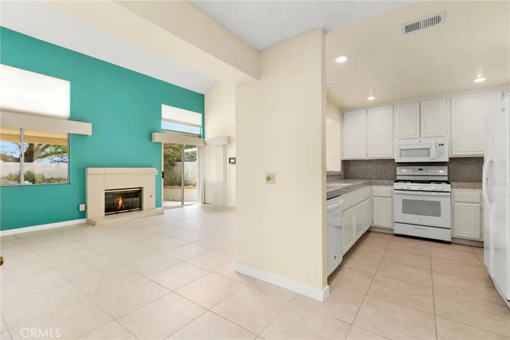 Family Room with gas fireplace open to kitchen