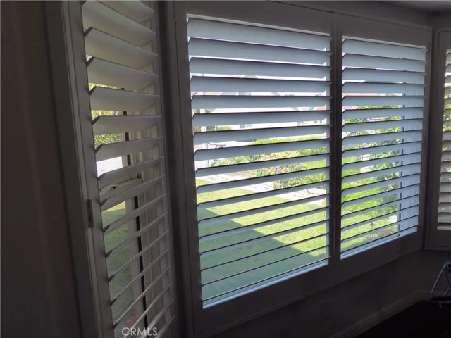 Bay Window with Wood Shutters facing Front Yard.