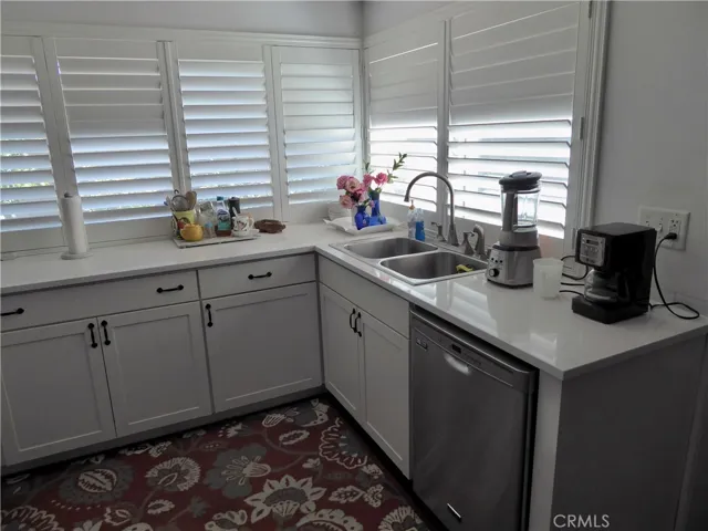 Remodeled Kitchen & showing Wood Shutters.