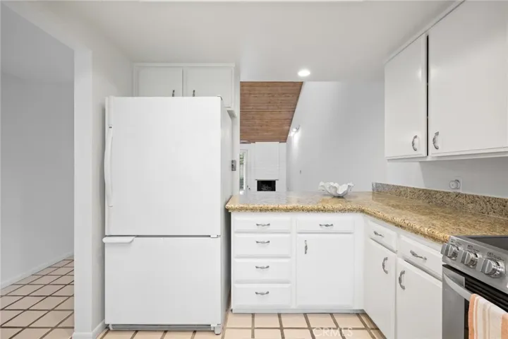 Kitchen opens to Dining and Living areas