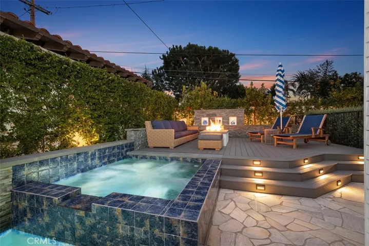 Waterfall and fire features with hot tub / saltwater plunge pool