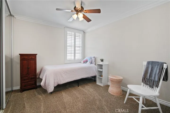 Bedroom #2 : all rooms have ceiling fans, plantation shutters and custom crown moldings.