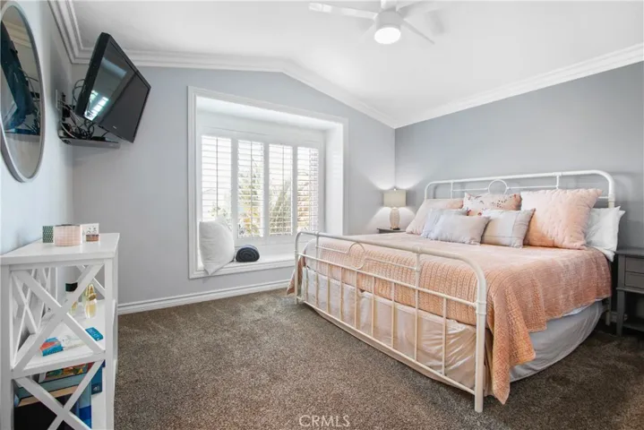 Primary bedroom complete with window bench seat, perfect for reading and viewing the backyard.
