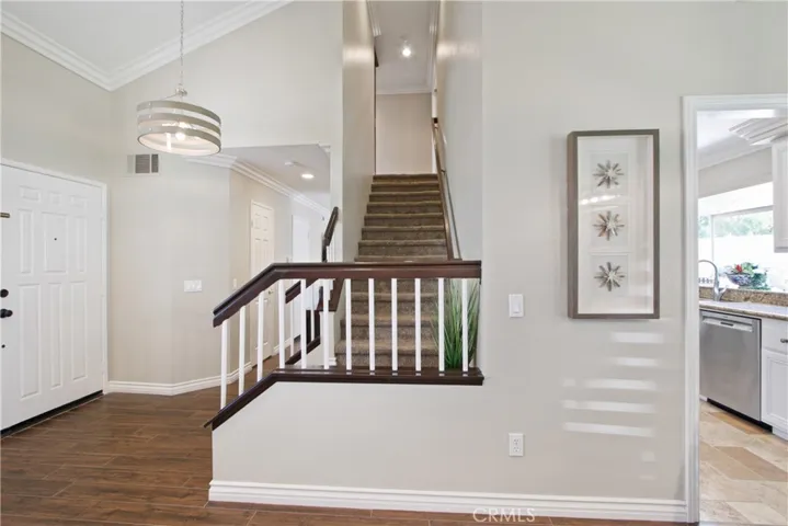 Stairs escorting you to the 4 bedrooms and 2 baths.