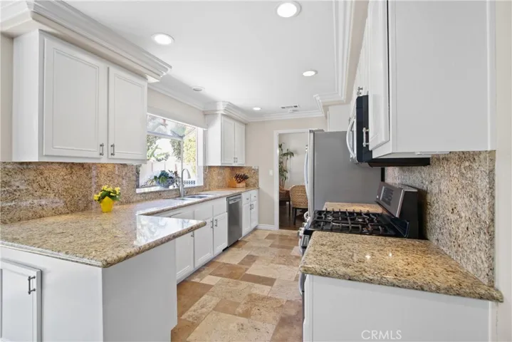 Easy to keep clean, granite counters, soft closing drawers and ample light!
