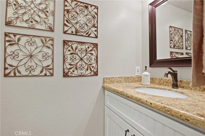 Downstairs powder room located in the hallway.