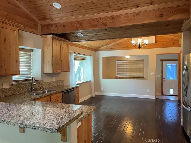 Large kitchen with granite countertops