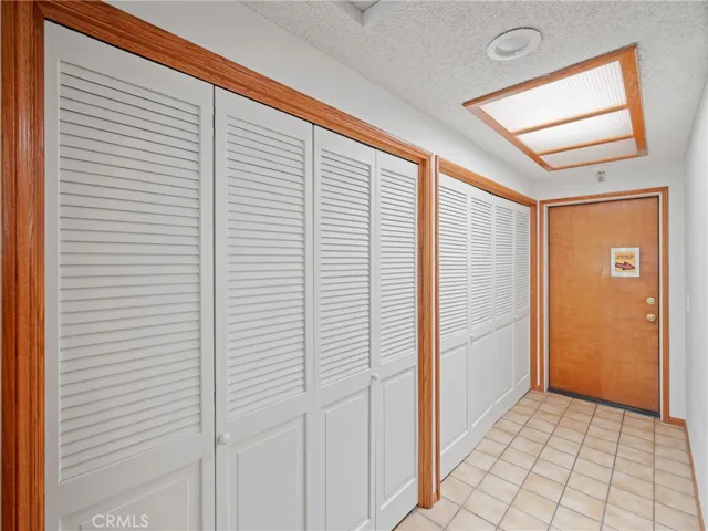 Hall storage in behind first set of doors. Laundry space behind last set of doors. Sky light brings the daylight inside.