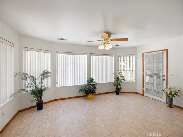 Door on the right leads you to the Covered Patio