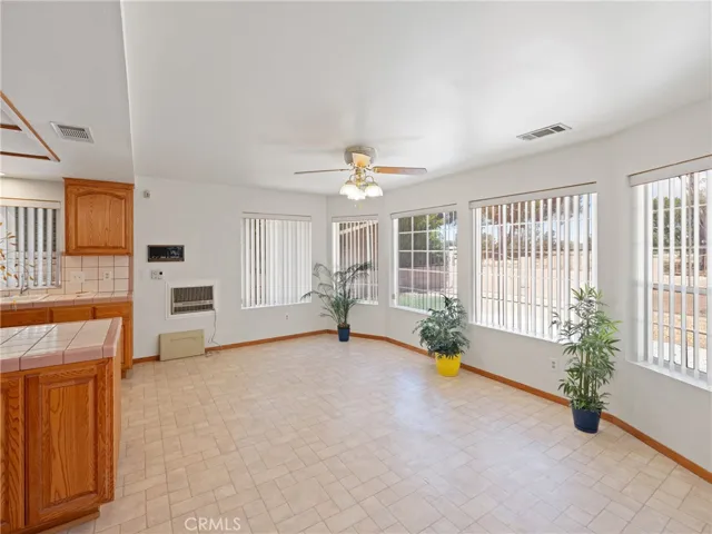 Dining in the kitchen area has prime view of the golf course