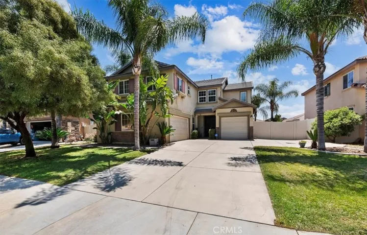 Front of House. Plenty of parking on the large driveway plus potential RV parking. Attached split 3-car garage and both have direct access to the home interior.