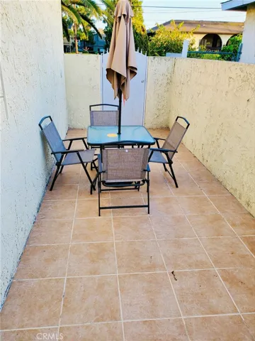 Third Tiled Patio with Metal Gate