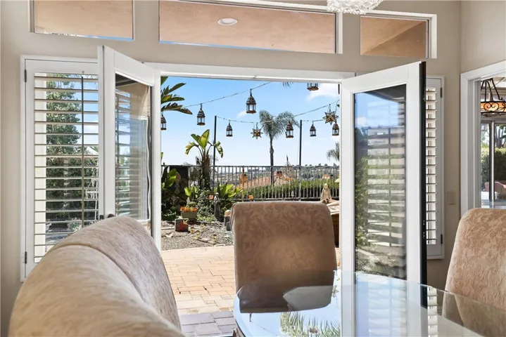 French Doors leading from Formal Dining Room to outdoor garden areas with lake views