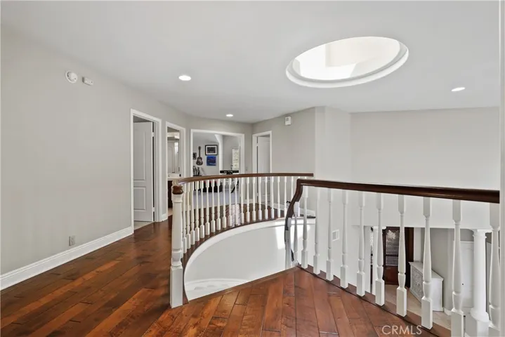 The dome skylight provides natural lighting at the landing on the second floor.
