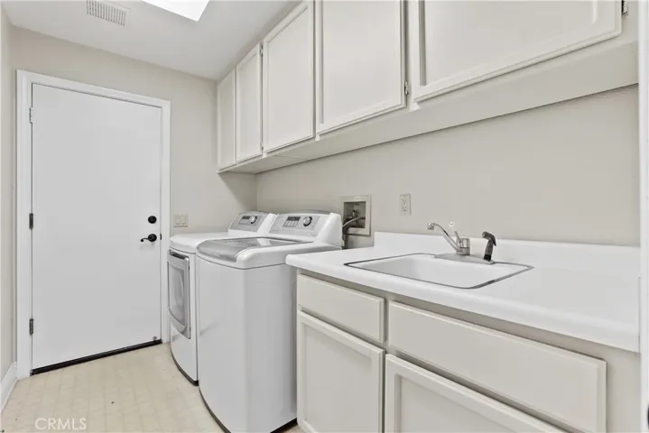 Large Laundry Room with sink & storage